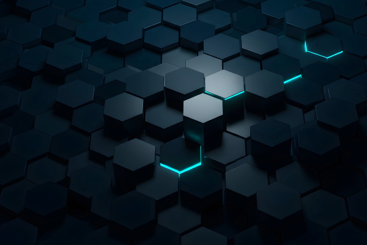 Abstract 3D hexagonal blocks with turquoise highlights on a dark surface, symbolizing structured financial frameworks, value proposition building blocks, and clarity in strategy and innovation.